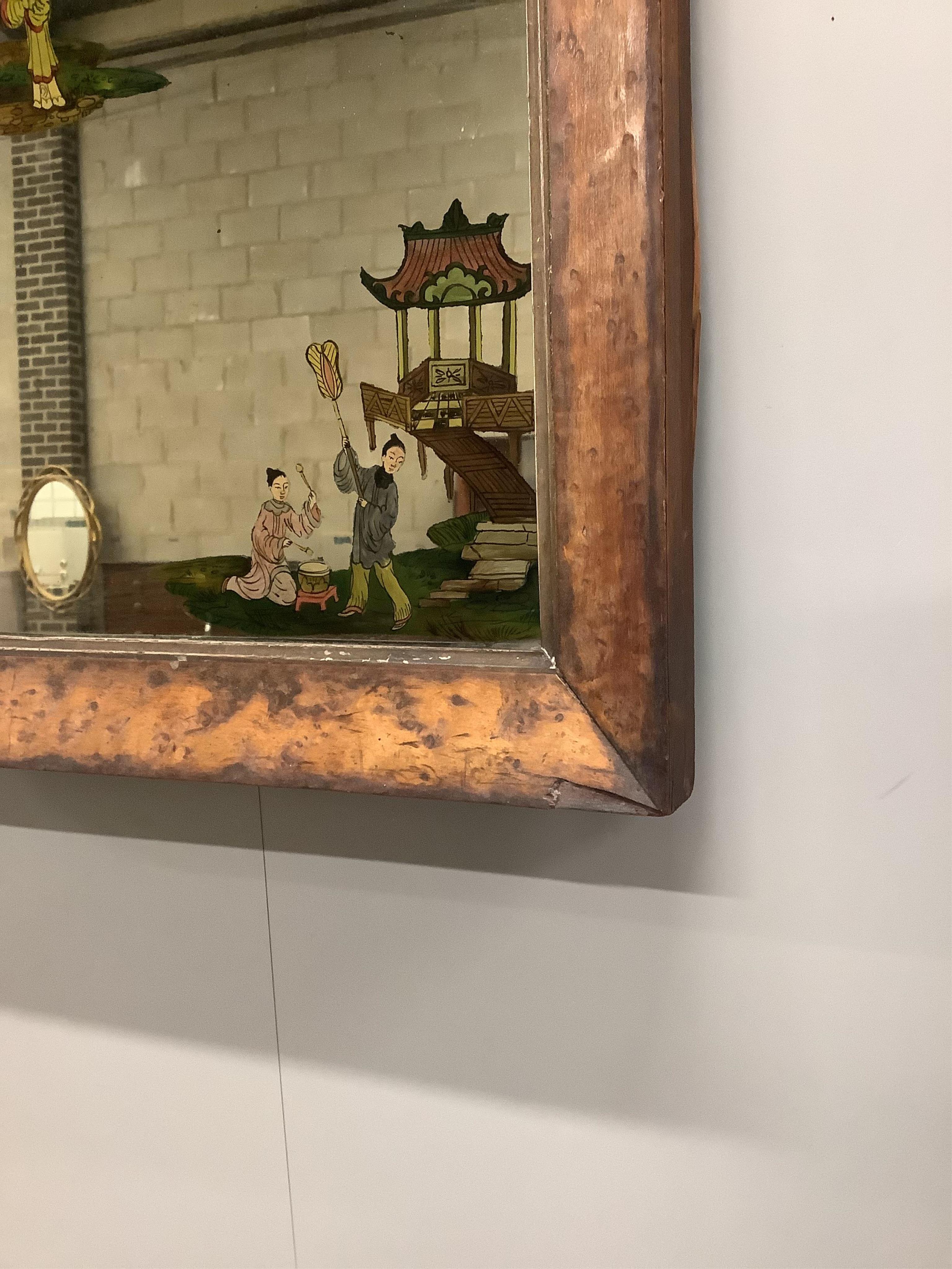 A late Victorian maple framed wall mirror with reverse painted chinoiserie decoration, width 44cm, height 55cm. Condition - fair